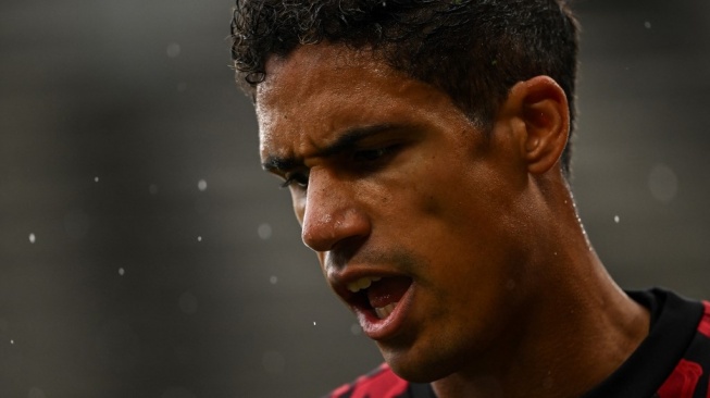 Bek Manchester United, Raphael Varane. [OLI SCARFF / AFP]