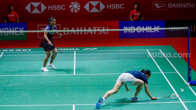 Pebulu tangkis Tunggal Putri Indonesia Gregoria Mariska Tunjung saat bertanding dengan Tunggal Putri Jerman Yvonne Li dalam babak 32 besar turnamen Indonesia Masters 2024 di Istora Senayan, Jakarta, Selasa (24/1/2024). [Suara.com/Alfian Winanto]