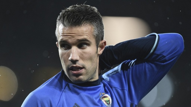 Mantan pemain Manchester United, Robin van Persie. [OLI SCARFF / AFP]