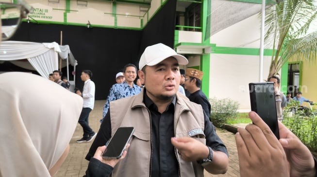 Komisioner KPU RI Mochammad Afifuddin. (Suara.com/Dea)