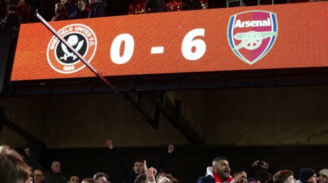 Papan skor di Stadion Bramall Lane, Sheffield menunjukkan keunggulan 6-0 Arsenal atas tuan rumah Sheffield United pada laga Liga Inggris yang rampung Selasa (5/3/2024) dini hari WIB. [Darren Staples / AFP]