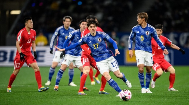 Suasana laga Kualifikasi Piala Dunia 2026 zona Asia antara Jepang vs Korea Utara di National Stadium di Tokyo, Kamis (21/3/2024). [Philip FONG / AFP]