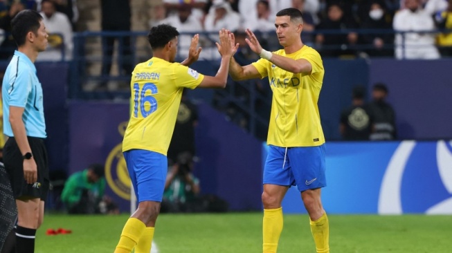 Penyerang Al Nassr, Mohammed Maran menggantikan Cristiano Ronaldo selama pertandingan Grup E Liga Champions Asia 2023-2024 antara al-Nassr vs Persepolis di Stadion Al-Awwal di Riyadh pada 27 November 2023.Fayez NURELDINE / AFP.