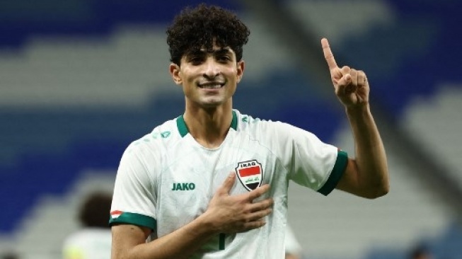 Penyerang Irak Ali Jasim merayakan golnya pada pertandingan perempat final Piala Asia U23 AFC Qatar 2024 antara Irak dan Vietnam di Stadion Al-Janoub di Doha pada 26 April 2024. KARIM JAAFAR / AFP