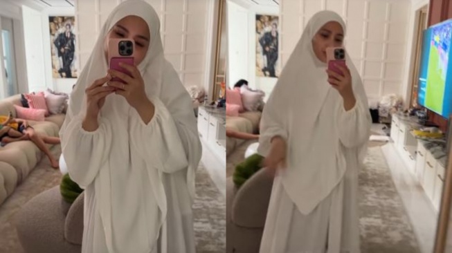 Gaya Nagita Slavina tertutup pakai gamis dan hijab. [Instagram/@raffinagita1717]