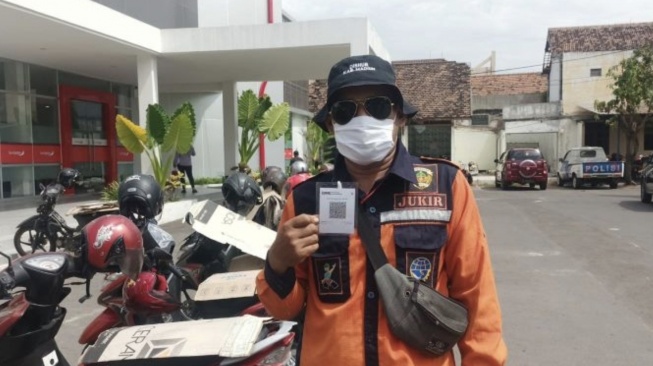 Cegah Kebocoran Pendapatan Daerah,  Pemkab Madiun Manfaatkan QRIS untuk Retribusi Parkir