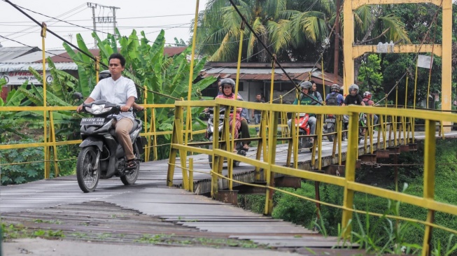 Kondisi jembatan gantung titi besi di Kota Bangun. [Ist]