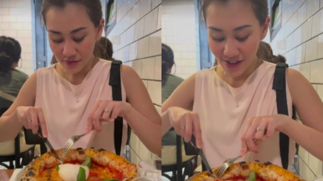 Aaliyah Massaid makan pizza. [Instagram]