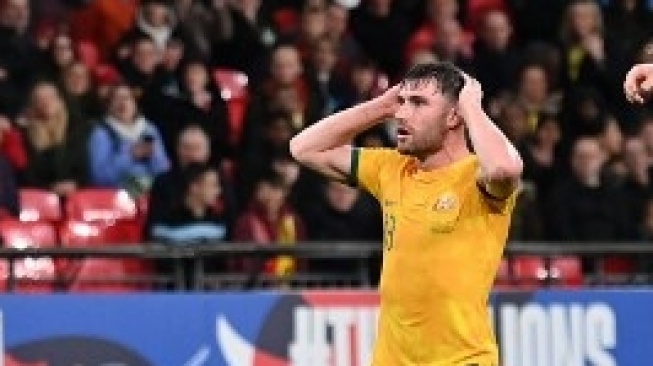 Bek Australia, Ryan Strain, bereaksi terhadap peluang yang terlewatkan selama pertandingan melawan Inggris di Stadion Wembley di London utara pada 13 Oktober 2023. (Glyn Kirk/AFP)