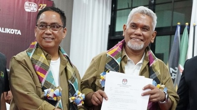 Calon Wali Kota dan Wakil Wali Kota Makassar Amri Arsyad - Abdul Rahman Bando [SuaraSulsel.id/KPU Makassar]