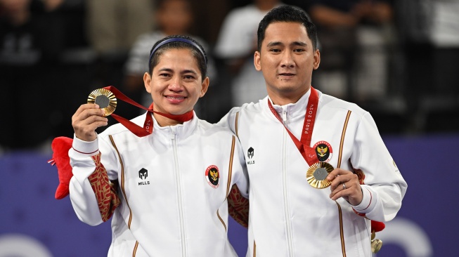 Kontingen Indonesia akhirnya meraih medali emas pertama di Paralimpiade Paris 2024 lewat pasangan Hikmat Ramdani-Leani Ratri Oktila. [NPC Indonesia]