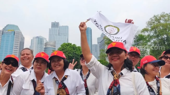 Scarf khas menghiasi busana umat asal Surakarta [Suara.com/CNR ukirsari]