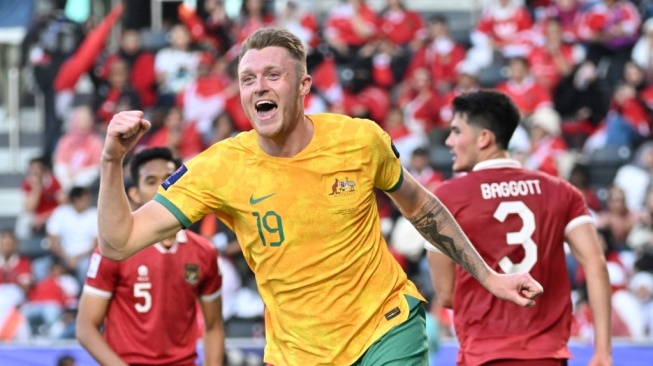 Bek Australia, Harry Souttar merayakan gol keempat timnya selama pertandingan Piala Asia 2023 antara Australia vs Indonesia di Stadion Jassim bin Hamad di Doha pada 28 Januari 2024.HECTOR RETAMAL / AFP.