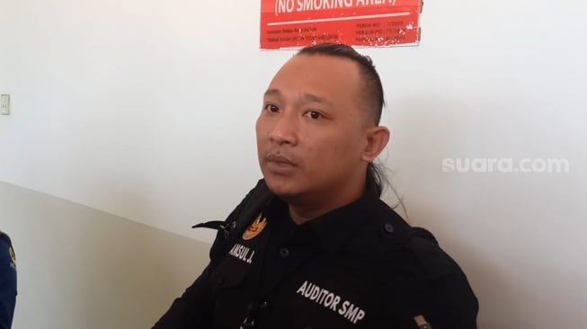 Syamsul, akademisi yang menggugat pangkat Letkol Tituler Deddy Corbuzier. [Suara.com/Rena Pangesti]