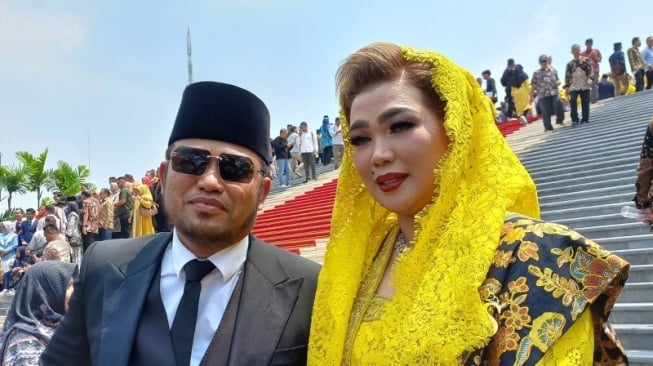 Potret Rudy Mas'ud dan Syarifah Suraidah. [Ist]