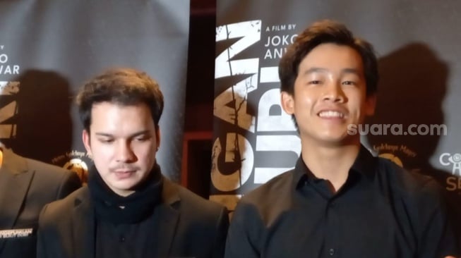 Keponakan Joe Taslim, Millo Taslim (kanan) dalam perilisan trailer film Pengepungan di Bukit Duri di XXI Plaza Senayan, Jakarta, Kamis (30/1/2025). [Suara.com/Adiyoga Priyambodo]