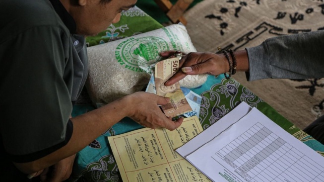 Bayarlah zakat fitrah di waktu yang tepat. [Dok. Antara]