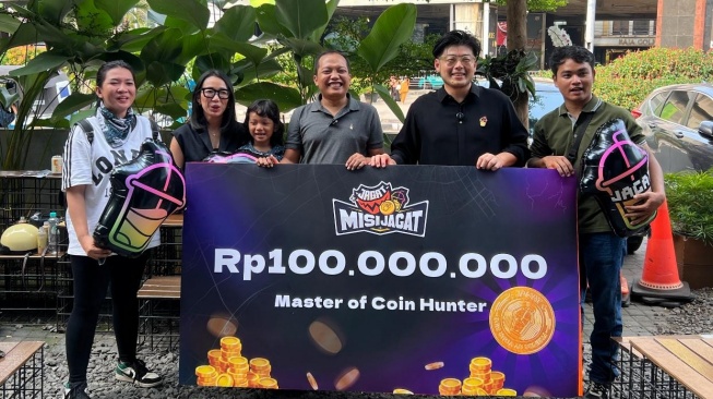 Yudi, warga asal Jakarta Barat berhasil memperoleh hadiah utama koin jagat Rp 100 juta. [Dok. Jagat]