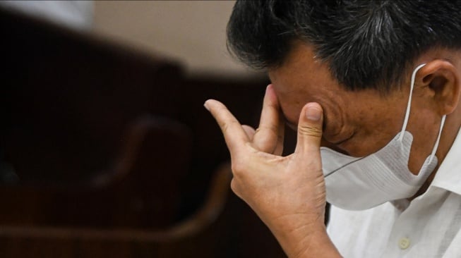 Terdakwa kasus dugaan korupsi pengelolaan tata niaga komoditas timah di wilayah Izin Usaha Pertambangan (IUP) PT Timah, Hendry Lie bersiap menjalani sidang dengan agenda pembacaan tuntutan di Pengadilan Tipikor, Jakarta, Kamis (22/5/2025). [ANTARA FOTO/Muhammad Adimaja/Spt]
