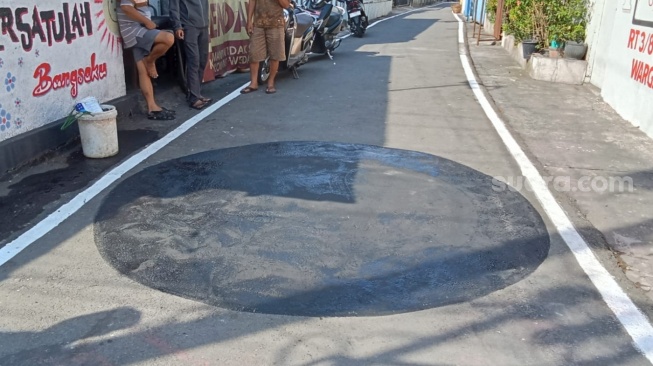 Bekas mural gambar one piece di Kelurahan Sewu, Kecamatan Jebres yang sudah dihapus.. (Suara.com/Ari Welianto)