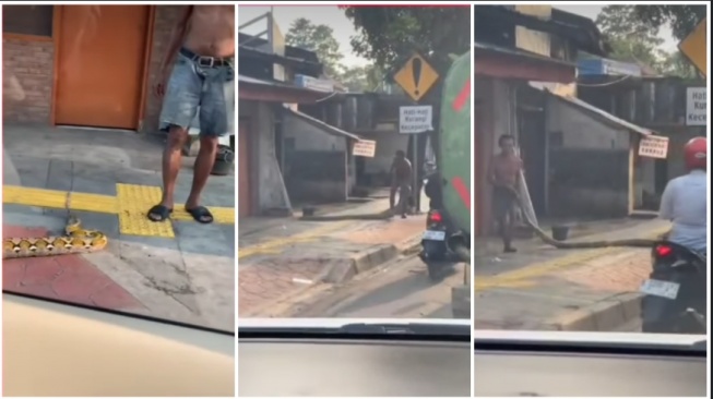 Seorang pria gunakan ular sanca batik mencegah pemotor masuk trotoar (Instagram)