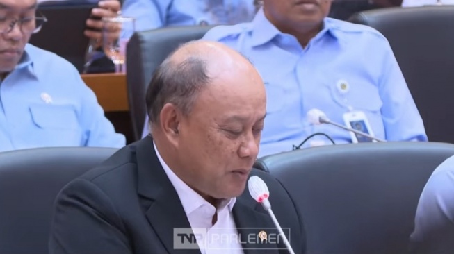 Kepala BGN Dadan Hindayana menyampaikan persoalan MBG saat rapat bersama Komisi IX DPR di Kompleks Gedung Parlemen, Senayan, Jakarta. [Tangkapan layar]