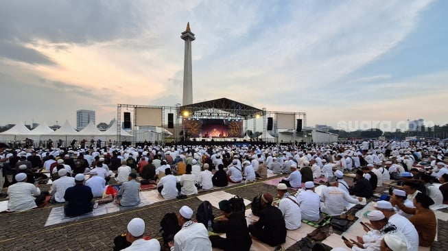 Aksi Reuni akbar 212 tahun 2025 di Monas yang digelar Selasa (2/12/2025). (Suara.com/Yoga)