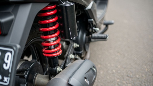 Ilustrasi Shockbreaker Motor Matic. (Google AI Studio)