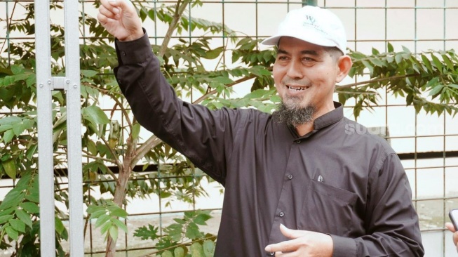 Muhammad Arif Budiman, Ketua RT 009, Lorong 103 Timur, Koja, Jakarta Utara. Selasa (20/1/2026). (Suara.com/Irene Anggraini)