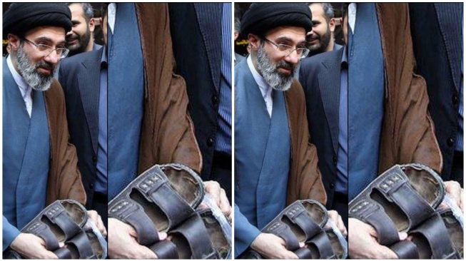 Ayatollah Ali Khamenei terpotret memegang sandalnya yang sudah butut.