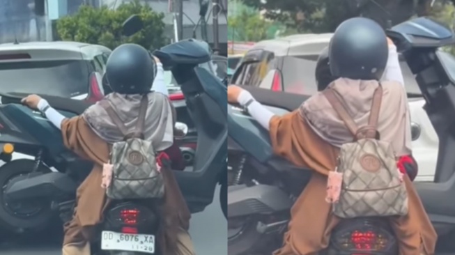 Bikin Melongo, Emak-Emak Ini Angkut Motor Listrik Sambil Dibonceng