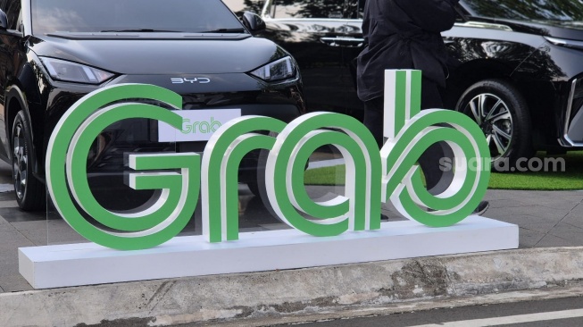 Logo Grab dalam agenda Langkah Hijau Grab untuk Indonesia di Jakarta, Senin (29/6/2026). [Suara.com/Dythia]