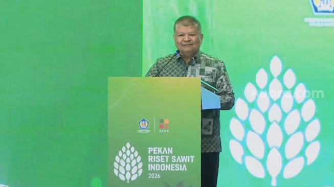 Staf Ahli Bidang Konektivitas dan Pengembangan Jasa Kementerian Koordinator Bidang Perekonomian, Dida Gardera saat membuka Pekan Riset Sawit Indonesia (Perisai) 2026 di Hotel Borobudur, Jakarta, Senin (20/7/2026). [Screenshot YouTube BPDP]