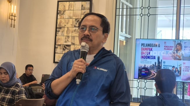 Direktur dan Chief Regulatory Officer XLSMART, Merza Fachys. [Suara.com/Dythia]