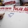 Warga Tolak Ahok dengan Cap Jempol Darah di Dekat Monas