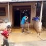 Banjir Surut, Warga Rawajati Mulai Bersihkan Rumah dari Lumpur