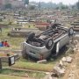 Pulang Ziarah, Mobil Nababan Terbalik di TPU Tanah Kusir