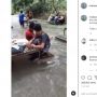 Heboh Orang Santai Makan di Tengah Derasnya Arus Sungai, Publik Ngeri