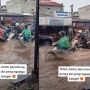 Pasangan Naik Motor di Tengah Banjir Curi Perhatian, Warganet: Iri Meronta