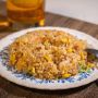 Pedagang Nasi Goreng Cosplay Jadi Pemain Musik, Masak Pesanan Sambil Joget