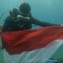 Merah Putih Berkibar di Kedalaman Jayapura: Aksi 34 Penyelam Bikin Merinding!