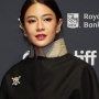 Elegan dan Sarat Pesan Sosial, Dian Sastro Pakai Pin One Piece di TIFF 2025