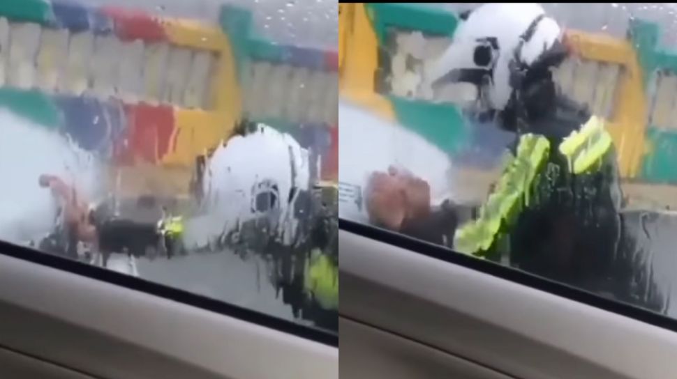 Viral Aksi Heroik Polisi Bantu Dorong Mobil Mogok saat Hujan Lebat