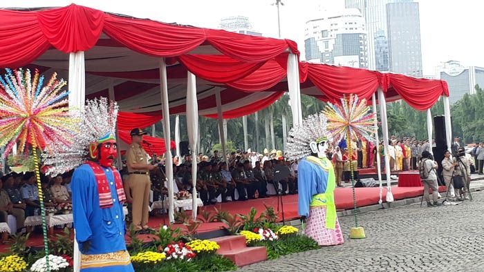 Gubernur DKI Jakarta Anies Baswedan menghadiri upacara Hari Bela Negara ke-69 di Lapangan Silang Monumen Nasional, Jakarta Pusat, Selasa (19/12/2017). [Suara.com/Ummi Hadyah Saleh]