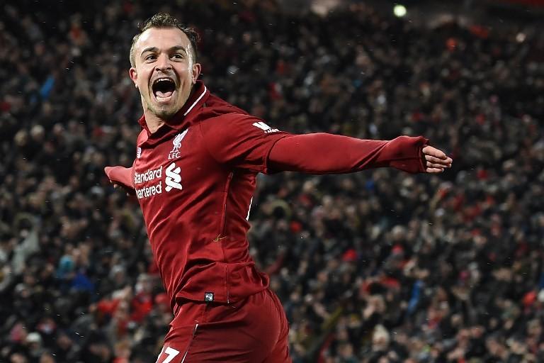 Gelandang serang Liverpool, Xherdan Shaqiri merayakan golnya ke gawang Manchester United pada laga lanjutan Liga Inggris 2018/2019 di Anfield, Senin (17/12/2018) dini hari WIB. [Paul ELLIS / AFP]