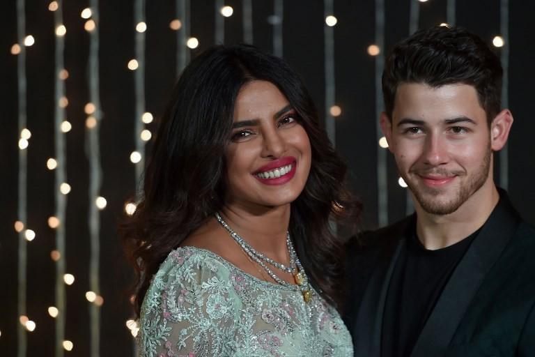 Priyanka Chopra dan Nick Jonas di acara resepsi pernikahan yang ketiga. (PUNIT PARANJPE / AFP)