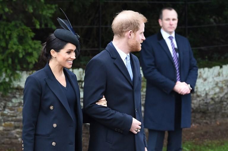 Meghan Markle (kiri) bersama sang suami, Pangeran Harry. [Paul ELLIS / AFP]