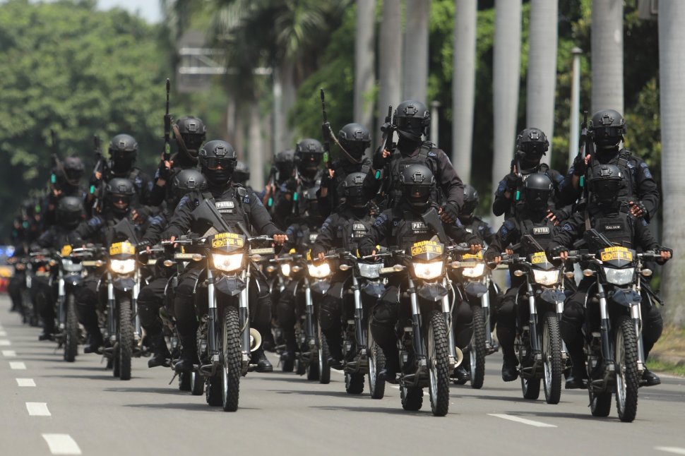 Prajurit TNI saat parade Pemberangkatan Patroli Skala Besar TNI-Polri di JIExpo, Kemayoran, Jakarta Pusat, Minggu (14/4). [Suara.com/Muhaimin A Untung}