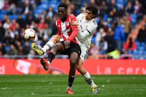 Pemain Real Madrid Jesus Vallejo berduel dengan pemain lawan dalam sebuah pertandingan La Liga [AFP]