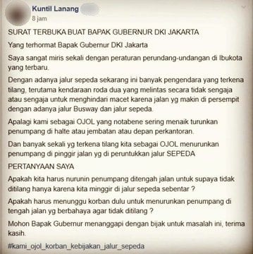 Ojek online ditilang karena berhenti di jalur khusus sepeda. (Twitter/@Ojol_Indo)